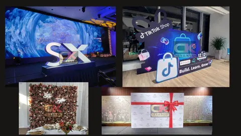 Event stage with freestanding letters and layered retail campaign display
