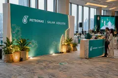 PETRONAS corporate raya celebration design reference with corporate festive media and dining wall
