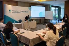Subang Jaya Medical Centre seminar design reference with small seminar workshop table and presenter backdrop
